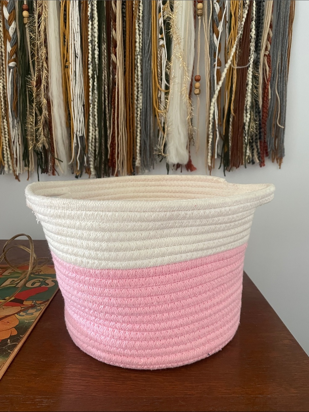 Pink and white braided basket with handles